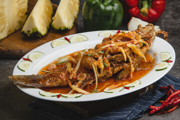 Delicious Fried Fish with Spicy Sauce and Vegetables.