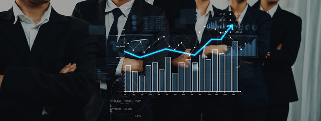 Business professionals display confidence in suits while standing together, with digital data charts and graphs illustrating achievement and growth in a corporate setting. Scalp
