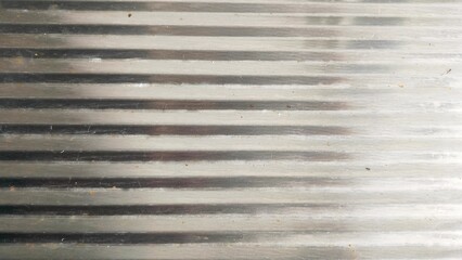 Old Glossy gray metallic background. Shiny and reflective surface with a sleek and elegant texture. Stainless steel texture or metal texture background