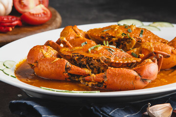 Delicious Chili Crab Dish Served on a White Plate.