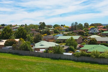 Overhead drone view of house roofs in a suburban housing development.
Overhead drone view of house roofs in a suburban housing development in Australia; illustrating the housing affordability crisis
