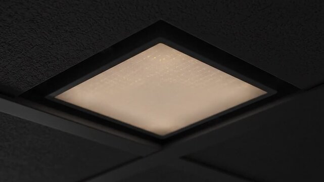 Modern square ceiling light fixture emitting bright white light