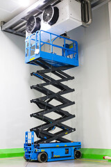Scissor Lift Aerial Work Platform in Distribution Warehouse