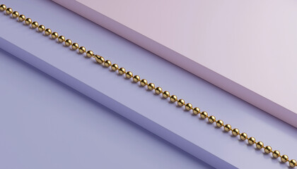 A long golden beaded chain lying diagonally across a minimalist background with light purple and pink sections.