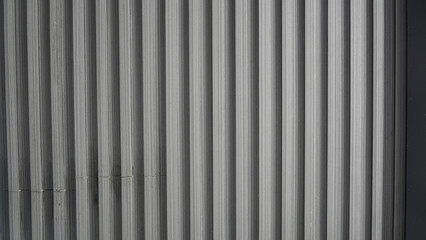 Close up of Corrugated Metal Sheet with Vertical Lines and Textured Surface