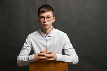 The young man crossed his fingers. concept.