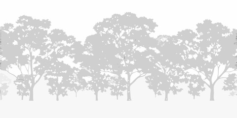 Silhouette of trees against a pale gray background creating a peaceful scene