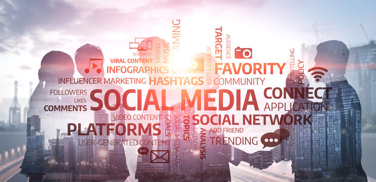 Two business professionals shake hands against a dynamic background of social media terminology, symbolizing collaboration and modern marketing strategies in a digital world. Tessel