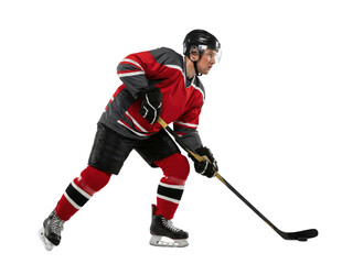 Obraz premium Ice hockey player in red uniform skating with stick isolated on white