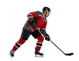 Ice hockey player in red uniform skating with stick isolated on white