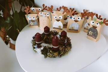 Christmas Advent wreath and Advent calendar with gifts
