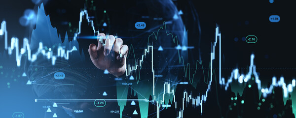 Futuristic trading concept with hand interacting with holographic forex and cryptocurrency charts on digital background displaying data points.