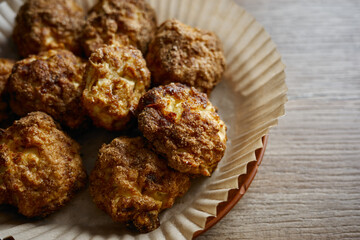 cottage cheese cookies with apples and cinnamon served in a paper tray on a wooden table at a casual dining setting in the afternoon