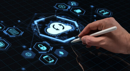 Hand with stylus interacting with cloud computing hologram interface on digital screen in futuristic tech environment concept background..