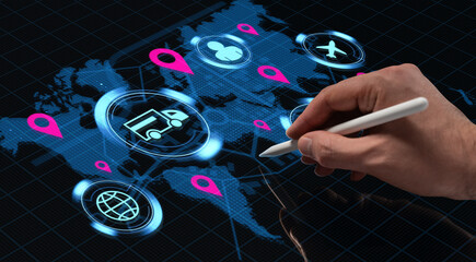 Hand with stylus interacting with digital world map hologram showing logistics, travel, and communication icons on futuristic tech interface screen.