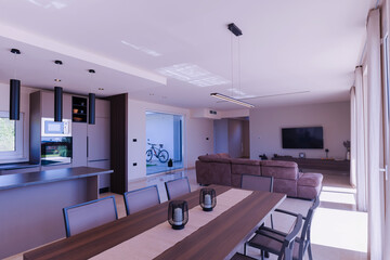  Modern open-plan living and dining room in a luxury villa with large glass doors opening to a private swimming pool, offering a spacious and elegant indoor-outdoor living experience