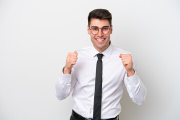 Business caucasian man isolated on white background celebrating a victory in winner position