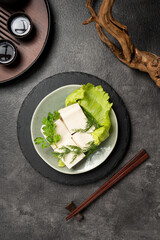 Fresh Tofu Dish with Lettuce and Chopsticks.