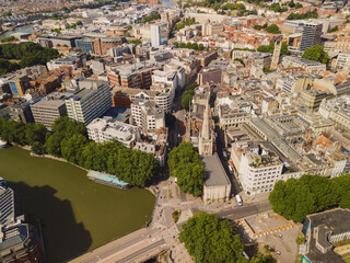 Bristol UK: 28th Jul 2025: Feeder Canal in Bristol UK with buildings lining the waterway. Boats are present on the canal. The city landscape stretches in the background