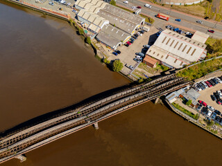 Blaydon on Tyne UK: 15th August 2025: Old rail Bridge towards Blaydon Industrial Estate, drone view top-down