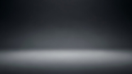 Empty studio backdrop with a spotlight creating a bright floor reflection