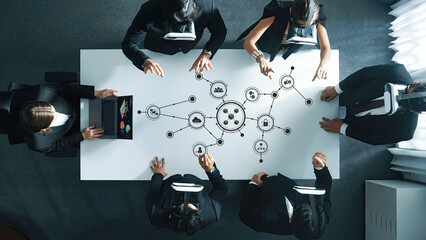 A diverse business team engages with virtual reality technology in a modern office setting, brainstorming innovative ideas and analyzing complex data for effective solutions. Amity