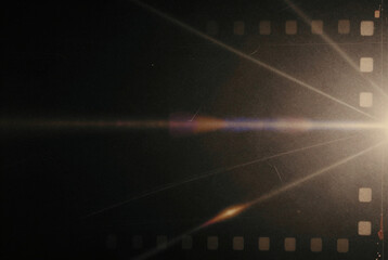 Film strip with a bright light shining through it.