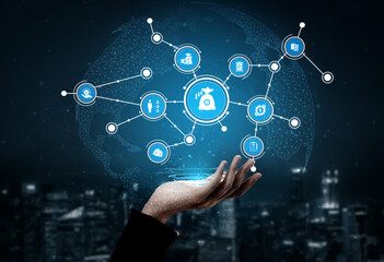 This stock photo captures a hand extending towards a digital network of technology icons. The visual symbolizes global connectivity and innovation in a modern city backdrop. Tessel
