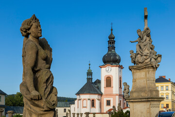 Naklejka premium Baroque church and religious statues in Manetin, Czechia