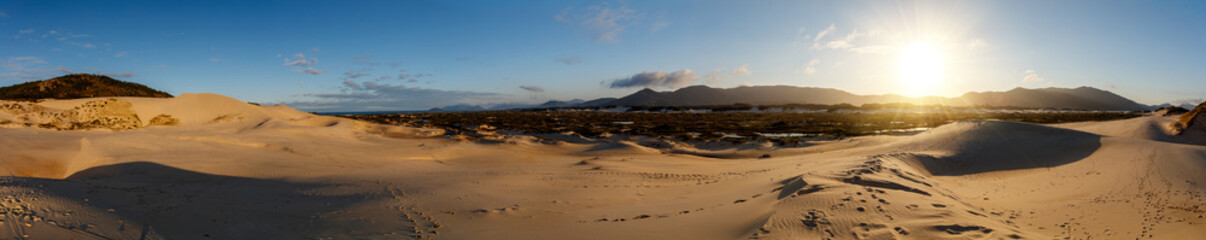 Panoramic view of the Joaquina dunes at sunset on Florianopolis Island, Santa Catarina, Brazil.