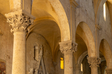 Naklejka premium Ancient church arches and columns in Tuscany, Italy