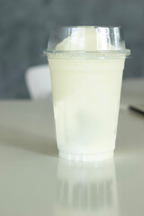 A smoothie placed on the table in a café during a holiday break.