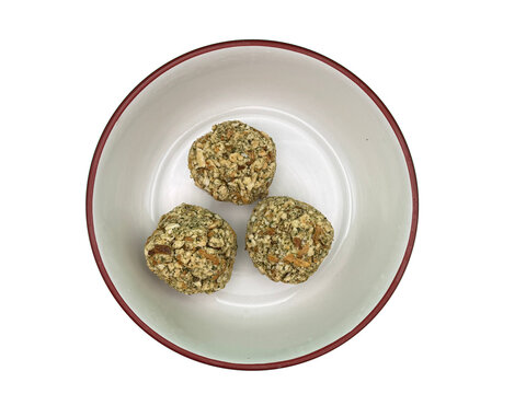 A bowl with three balls of stuffing