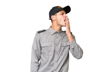 Young security man over isolated background yawning and covering wide open mouth with hand