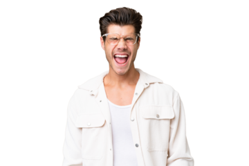 Young handsome caucasian man over isolated background shouting to the front with mouth wide open