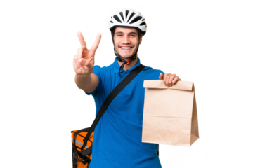 Young caucasian man taking a bag of takeaway food over isolated background smiling and showing victory sign