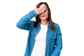 Middle age woman over isolated chroma key background covering eyes by hands. Do not want to see...