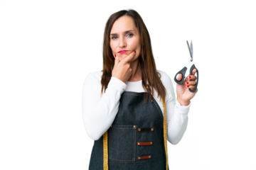 Seamstress woman over isolated chroma key background thinking