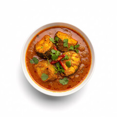 Delicious Indian Fish Curry with Fresh Herbs and Chili Peppers in Bowl