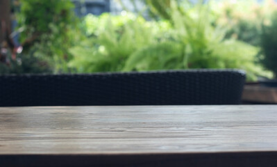 Wooden table surface with natural cafe background