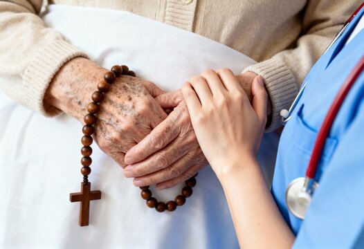 Nurse comforting an elderly patient with a rosary. Caregiver supporting a senior woman in a hospital. Faith, compassion, and healthcare concept