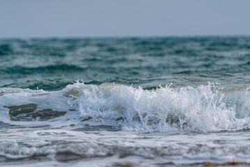 White-capped sea waves on the shore