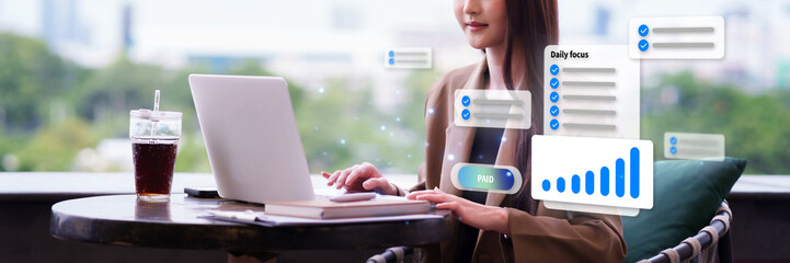 Asian adult business professional woman working online laptop computer remote outdoor cafe balcony managing tasks digital reports increasing revenue