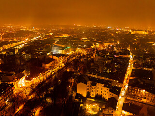 Krak&oacute;w in Orange Haze: Minimalist Night Skyline with Negative Space