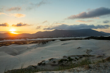 Panoramic view of the Joaquina dunes at sunset on Florianopolis Island, Santa Catarina, Brazil.