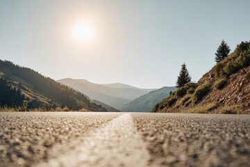 Low-angle close-up of a textured asphalt road with white dividing line in sharp focus