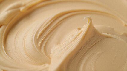 Close up of smooth creamy beige colored cosmetic product texture