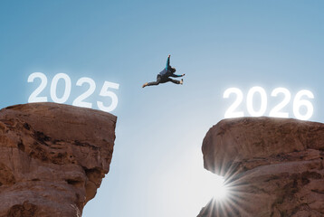 2026 new year concept, a man jumping from 2025 to new year 2026