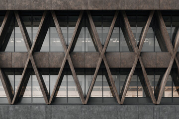 Modern building facade with shaped geometric structure and glass windows.