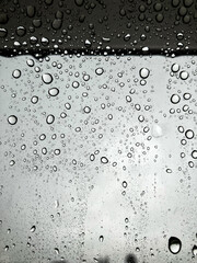 Rain Drops on Glass Surface. Abstract Water Droplets Texture Background.